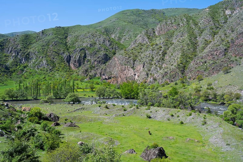 Green valley with agricultural environment and rolling hills. Scenic view, Kura River, Nakalakevi landscape, Samtskhe—Javakheti region, Samtske Javacheti, Lesser Caucasus, Georgia