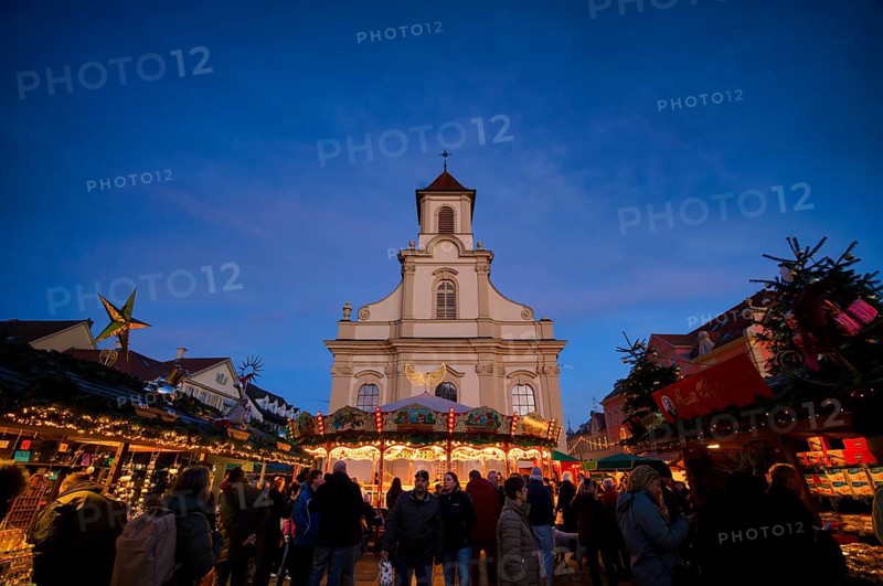 Carousel, catholic church of the Most Holy Trinity, people, visitors, baroque Christmas market, blue hour, dusk, Ludwigsburg, Baden-Württemberg, Germany