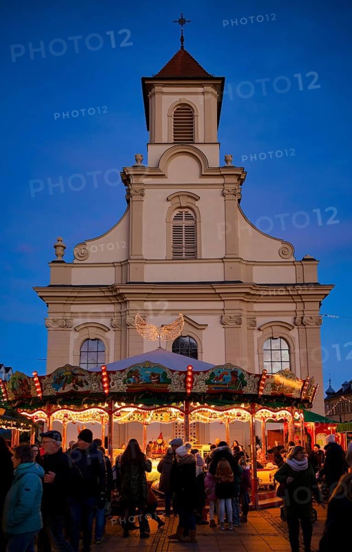 Carousel, catholic church of the Most Holy Trinity, people, visitors, baroque Christmas market, blue hour, dusk, Ludwigsburg, Baden-Württemberg, Germany