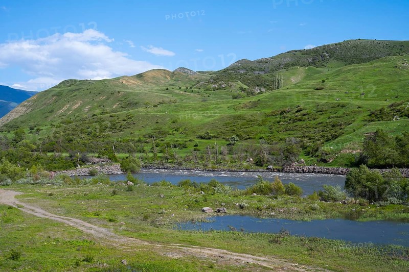 Green hills and a calm river under clear sky, Kura River between Akhaltsikhe, Akhaltsikhe and Aspindza, Samtskhe-Javakheti region, Samtskhe-Javakheti, Georgia