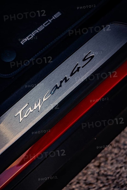 Close-up of a Porsche Taycan 4S emblem with focus on lettering and texture, Porsche Taycan, Deer Carsharing, Calw, Germany