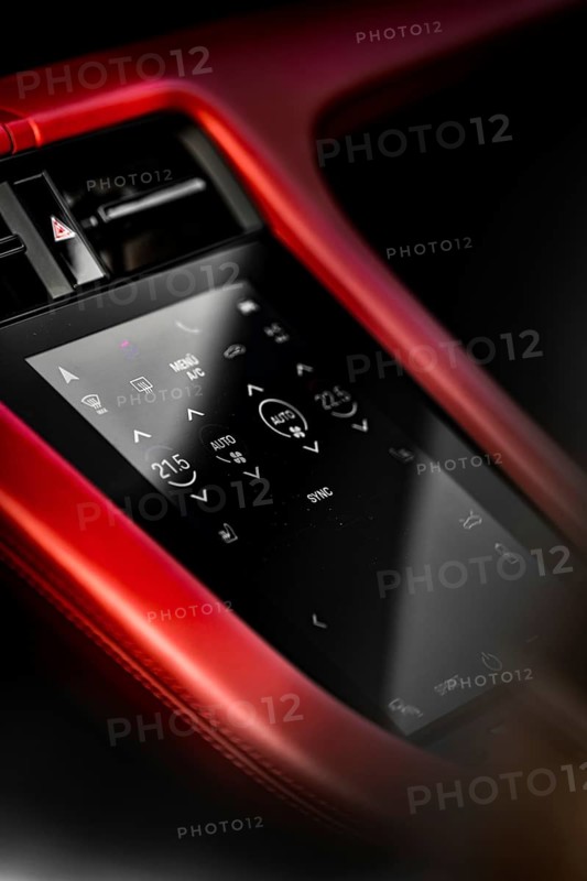 Close-up of car interior with red touchscreen control panel and modern displays, Porsche Taycan, Deer Carsharing, Calw, Germany