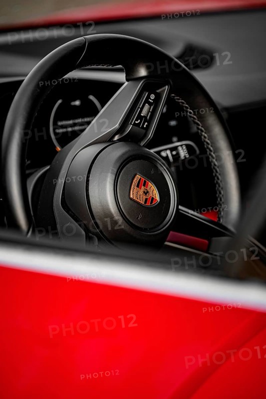 Close-up view of a Porsche steering wheel with modern design elements inside, Porsche Taycan, Deer Carsharing, Calw, Germany