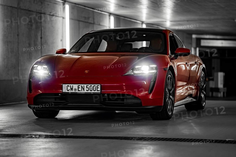 Red Porsche Taycan in underground car park at night with bright headlights and urban look, Porsche Taycan, Deer Carsharing, Calw, Germany