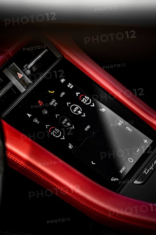 Close-up of a modern touchscreen control panel in a car with a red border, Porsche Taycan, Deer Carsharing, Calw, Germany