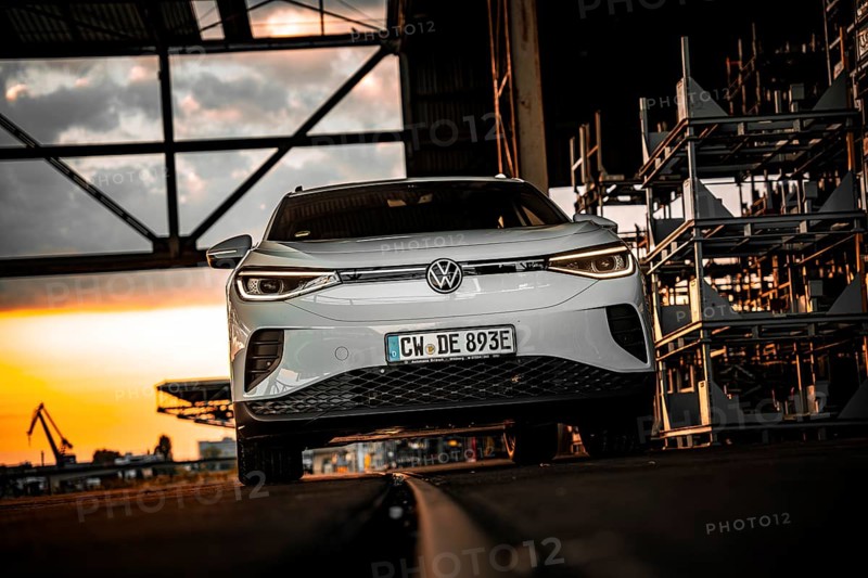 Silver car in an industrial building at dusk, VW ID4 electric car, Deer Carsharing, Calw, Germany