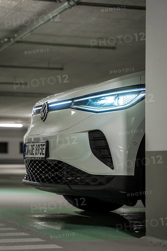 Modern car in an illuminated underground garage, sharp front view, VW ID4 electric car, deer car sharing, Calw, Germany