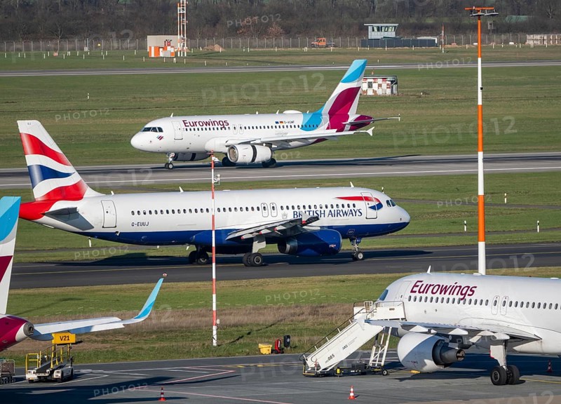 Eurowings aircraft, on field positions and on landing, British Airways Airbus A320-200 on their way to takeoff, Düsseldorf airport, DUS