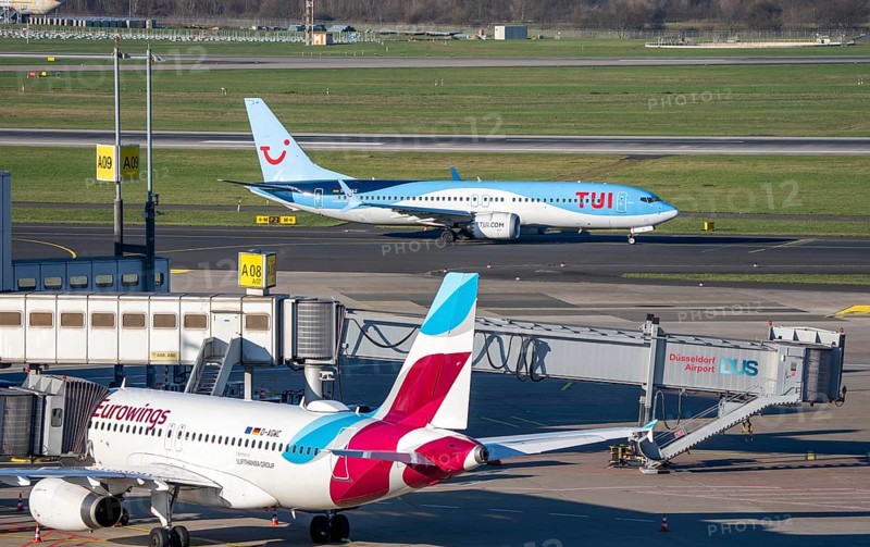 Eurowings aircraft, at Terminal A and TUI Fly Boeing 737 on the way to takeoff, Düsseldorf airport, DUS