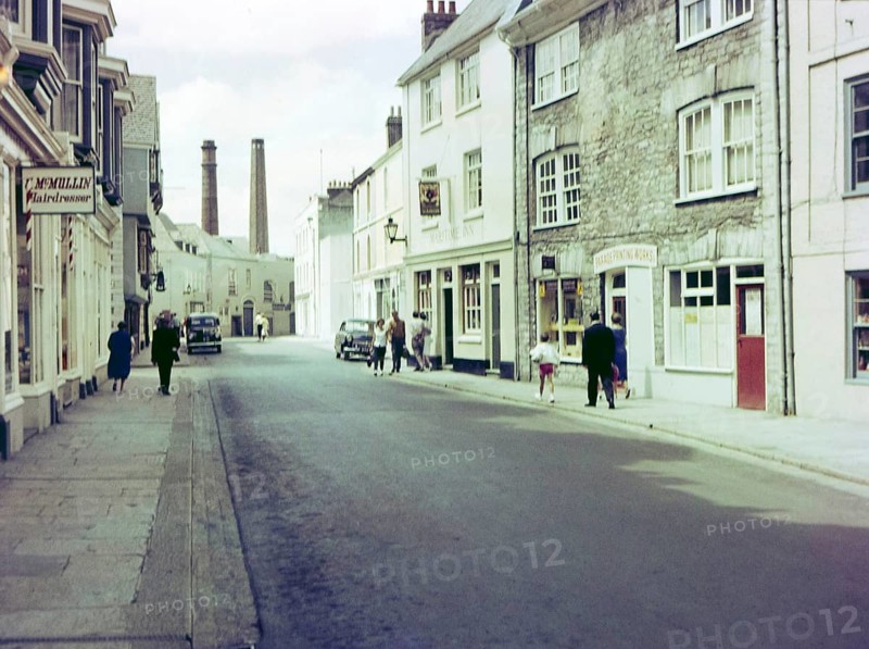 NB Poor focus, Historic Southside Street, Maritime Inn pub view to chimneys of gin distillery, Barbican, Plymouth, Devon, England, UK, c 1960
