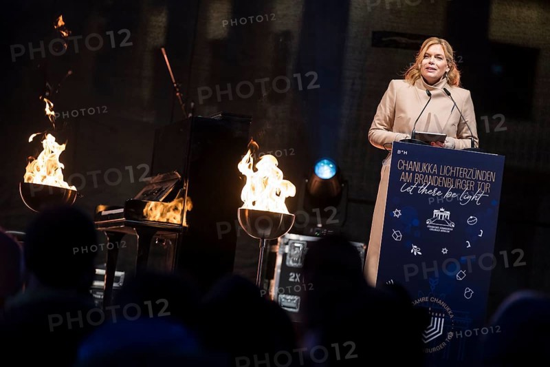 Julia Klöckner (President of the German Bundestag) speaks at the lighting of lights to mark 20 years of Hanukkah in front of the Brandenburg Tor, Berlin, 17 December 2025