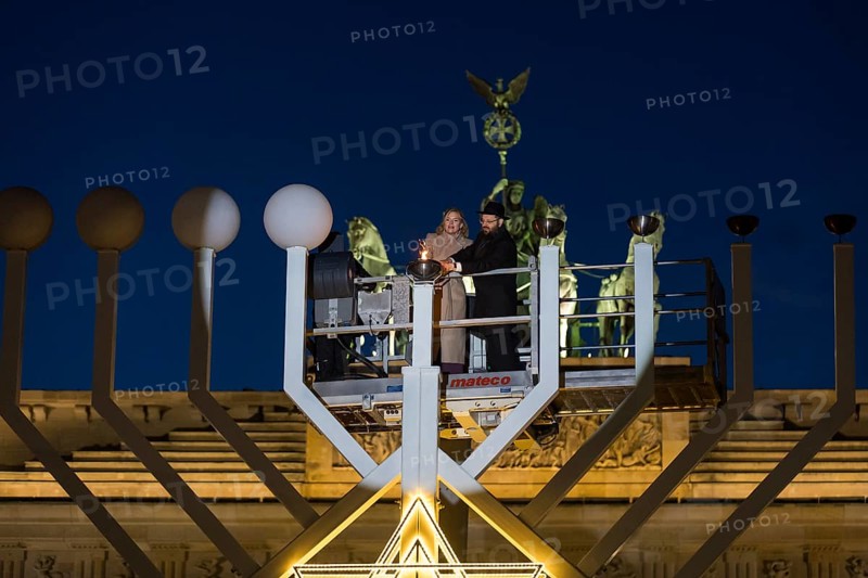 Julia Klöckner (President of the German Bundestag) and Rabbi Yehuda Teichtal (Rabbi of the Chabad-Lubavitch movement) at the lighting of lights to mark 20 years of Hanukkah in front of the Brandenburg Tor, Berlin, 17 December 2025