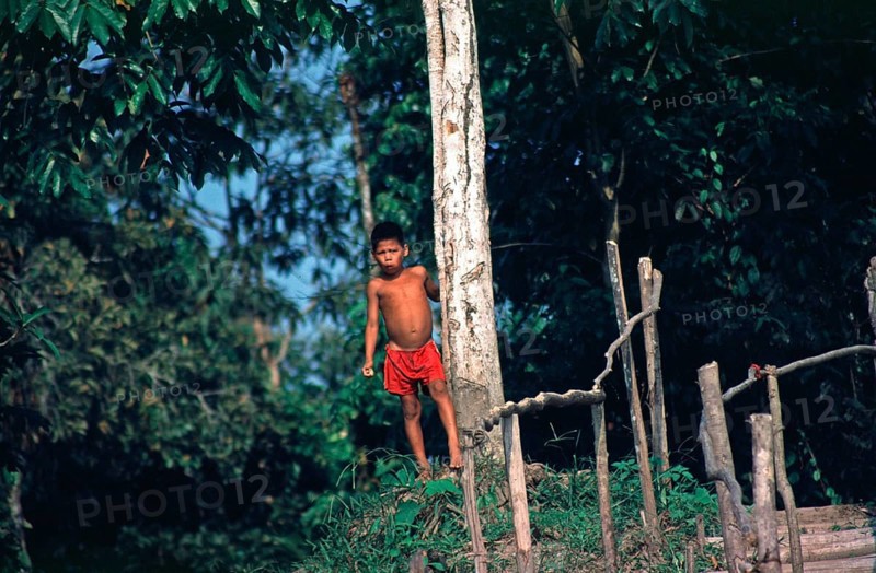 Little boy on the banks of the Amazon near Iquitos, Peru, South America, September 1997, vintage, retro, old, historic