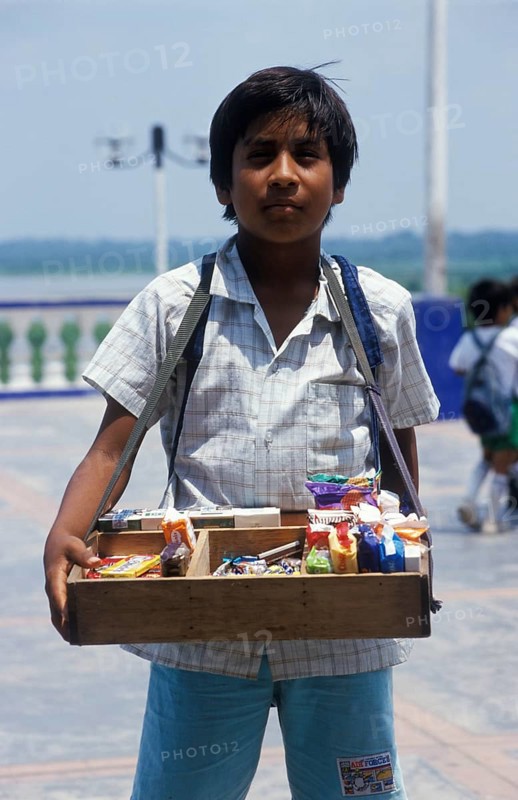 Boy with belly shop selling sweets in Iquitos, Amazon basin, Peru, South America, September 1997, vintage, retro, old, historic