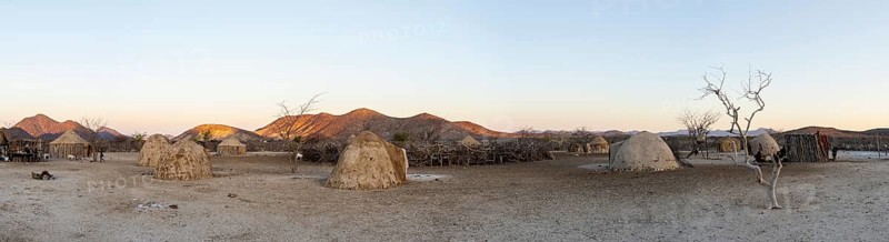 Panorama, Himba huts, traditional Himba village in the savanna, arid landscape, Kaokoveld, Kunene, Namibia