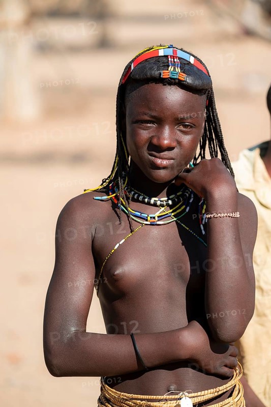 Portrait, brightly decorated girl of the Hakaona tribe, also Havakona or Hakawona, near Opuwo, Kunene, Namibia