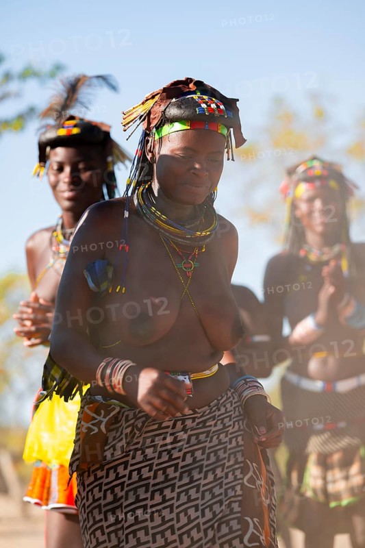Traditional dance, brightly decorated woman of the Hakaona tribe, also Havakona or Hakawona, near Opuwo, Kunene, Namibia