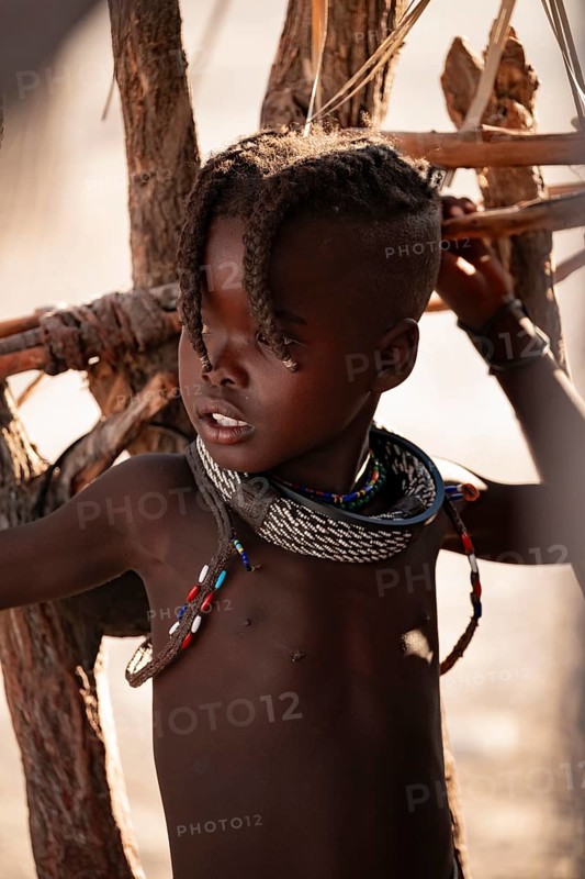 Portrait, young Himba child, traditional Himba village, Kaokoveld, Kunene, Namibia