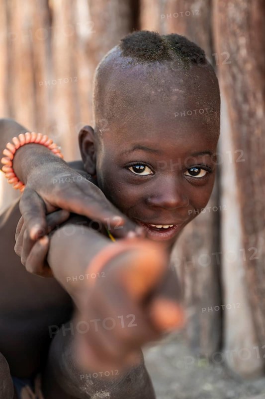 Portrait, funny Himba child, traditional Himba village, Kaokoveld, Kunene, Namibia