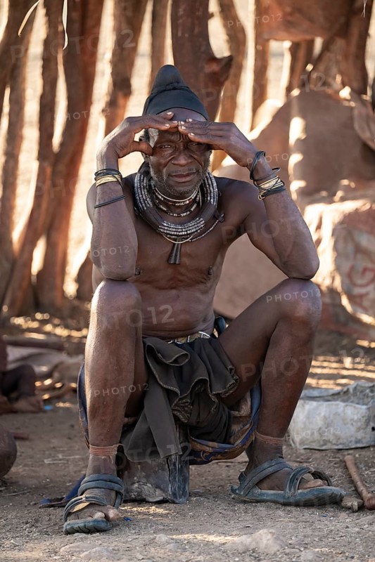 Elderly man, leader of the Himba, traditional Himba village, Kaokoveld, Kunene, Namibia