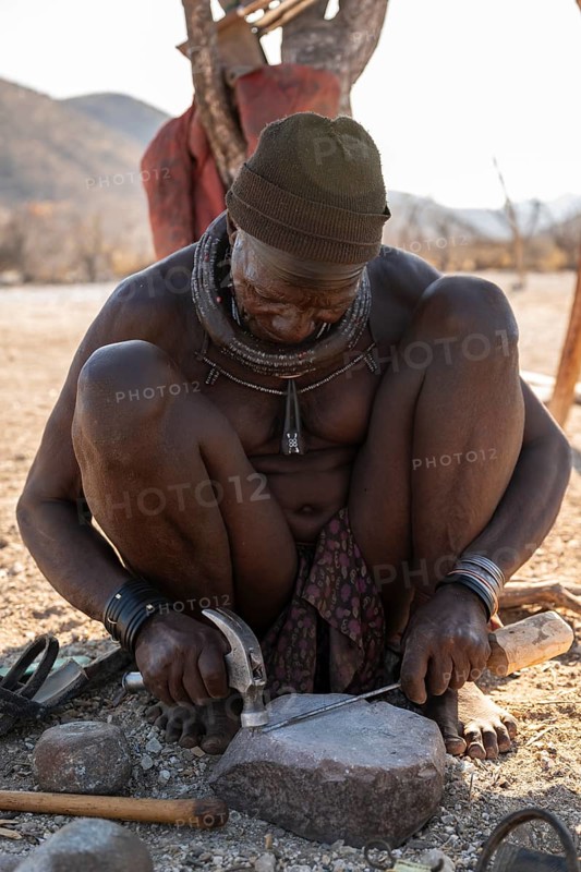 Elderly man, Himba blacksmith, traditional Himba village, Kaokoveld, Kunene, Namibia