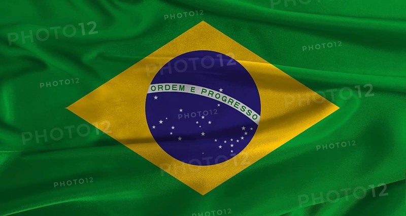 Flag of Brazil with fabric textured background. Close up of National flag of Brazil with realistic texture