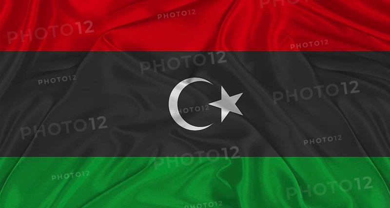 Libyan flag with fabric texture. Realistic flag of Libya waving, National flag