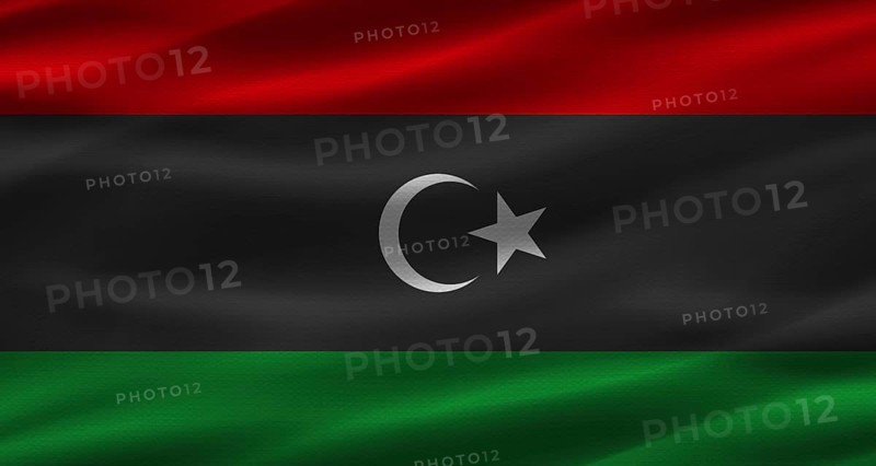 Libyan flag with fabric texture. Realistic flag of Libya waving