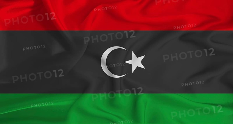 Realistic Libya flag waving. Close up of flag of Libya with cloth texture