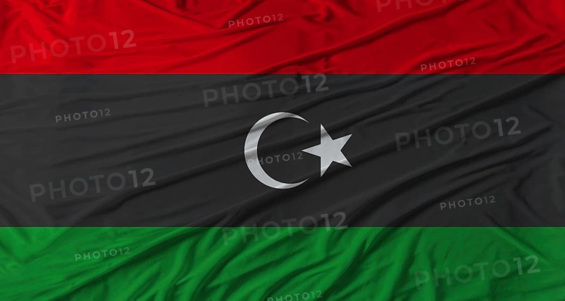 Libyan flag waving. Flag of Libya with cloth texture