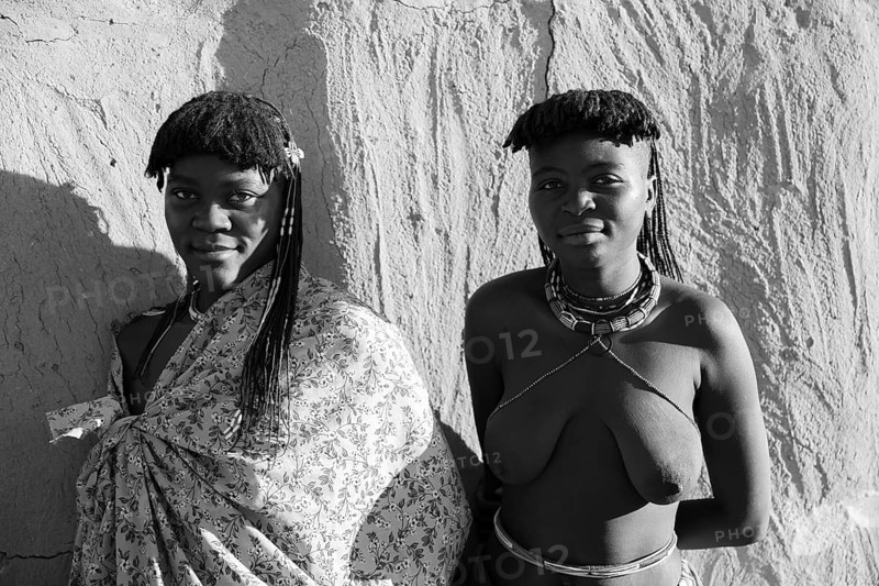 Black and white, portrait, brightly decorated woman of the Hakaona tribe, also Havakona or Hakawona, near Opuwo, Kunene, Namibia