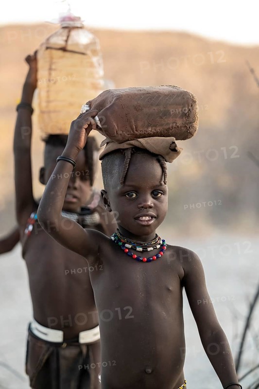 Himba children fetches water, carries canisters, traditional Himba, Kaokoveld, Kunene, Namibia
