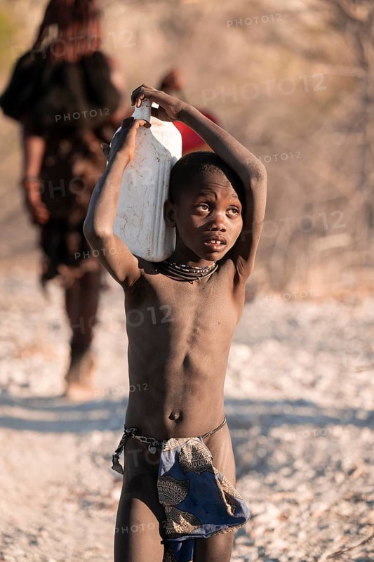 Himba child fetches water, carries canisters, traditional Himba, Kaokoveld, Kunene, Namibia