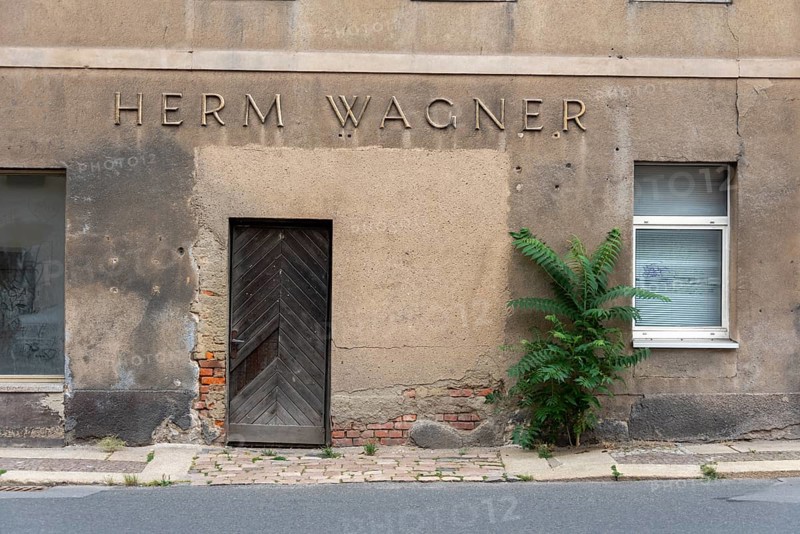 Dilapidated building with the inscription Herm Wagner, Altenburg, Thuringia, Germany