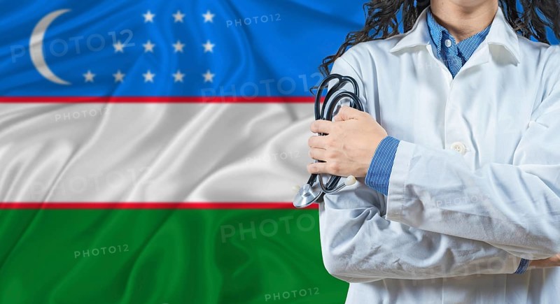 Healthcare professional with Uzbekistan flag background. Professional doctor holding stethoscope on Uzbekistan flag background
