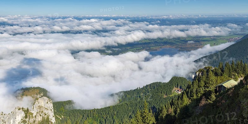Panorama from Tegelberg, 1881m, of the cloud-covered Forggensee and Bannwaldsee, Ostallgäu, Bavaria, Germany