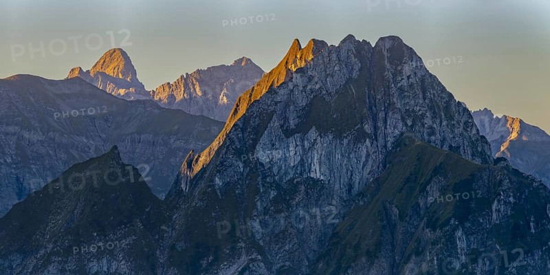 Mountain panorama at sunrise from Nebelhorn, 2224 m, to Höfats 2259 m, behind it the Große Krottenkopf illuminated by the morning sun, 2656m Allgäu Alps, Allgäu, Bavaria, Germany
