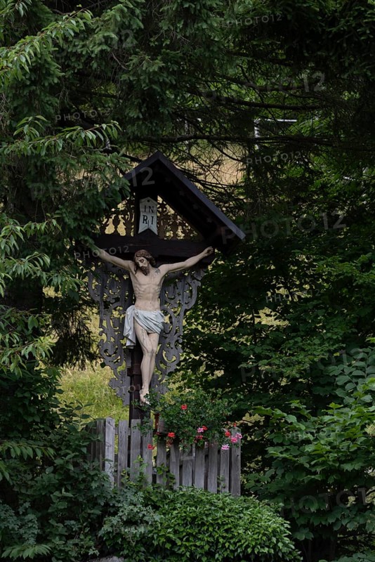 Traditional waycross with figure of Christ, mountaineering village Zgornje Jezersko, Slovenia