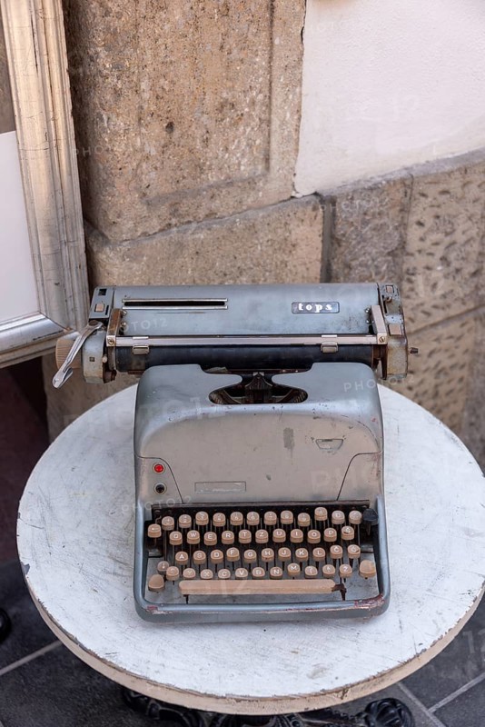 Historic typewriter on a small table, old town of Ljubljana, Slovenia