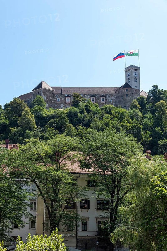 Ljubljana Castle towers over the city on a wooded hill, Ljubljana, Slovenia