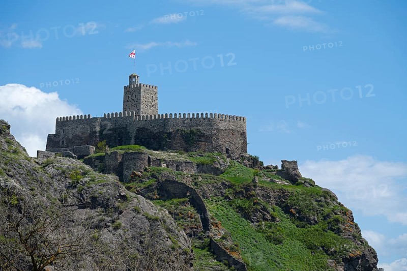 Medieval castle on a steep hill with stone walls and a watchtower under a blue sky, Rabati Fortress, Akhaltsikhe, Samtskhe-Javakheti region, Samtskhe-Javakheti, Georgia