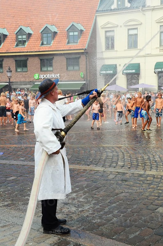 A popular event every year in August is when the Ystad Volunteer Fire Brigade takes the old fire pump made in 1850 to the square and sprays water on the assembled children, who are then baptized as true Ystad residents. Ystad, Skåne County, Sweden, Scandinavia