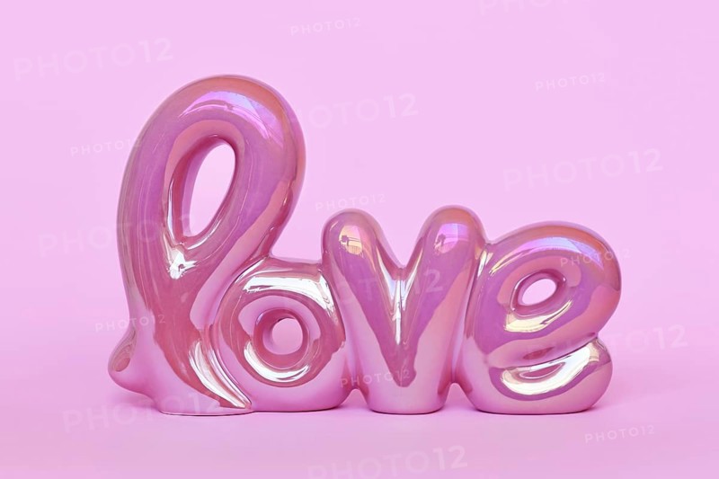 Cute Valentine's day text ornament 'love' on pastel pink background