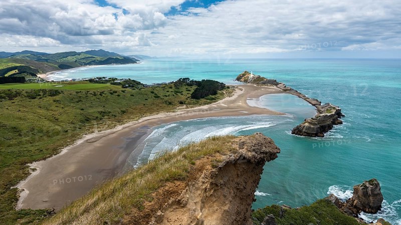 Deliverance Cove and Castlepoint Lighthouse, Castle Rock views, rocks, ocean. Castlepoint, Wairarapa Coast, Wellington Region, North Island, New Zealand