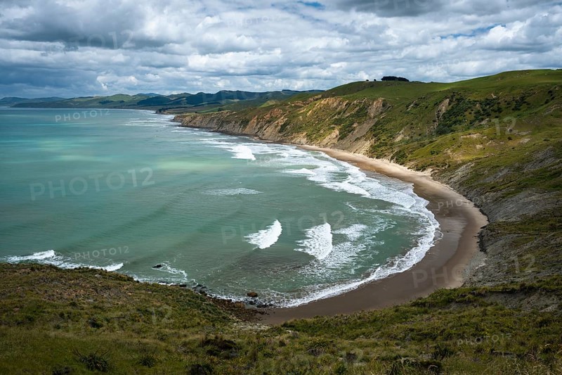 Wairarapa coast, sea, mountains. Castlepoint, Wairarapa Coast, Wellington Region, North Island, New Zealand