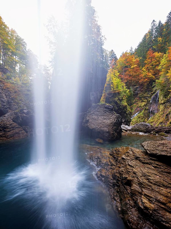 Waterfall mountain list in autumn-colored surroundings, Linthal, Klausenpass, Canton of Glarus, Switzerland