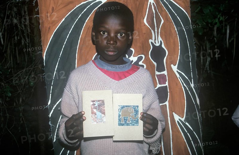 Child with homemade artwork in a self-help project in Chitungwiza near Harare, Zimbabwe, Africa, June 2000, vintage, retro, old, historical