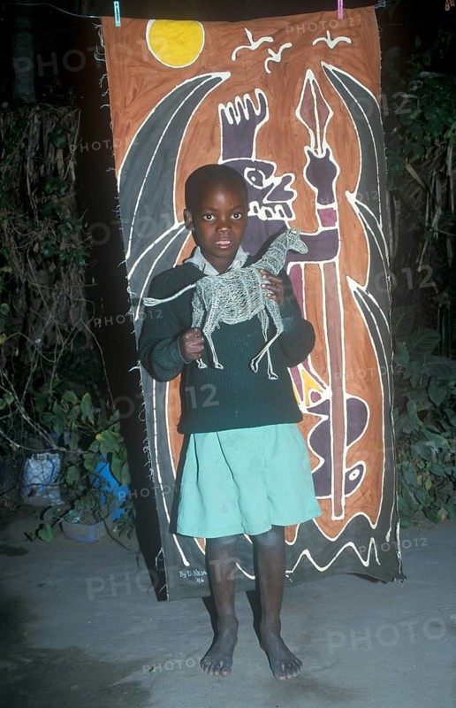 Child with homemade artwork in a self-help project in Chitungwiza near Harare, Zimbabwe, Africa, June 2000, vintage, retro, old, historical