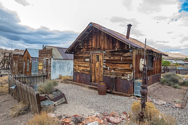 Tonopah, Nevada - The Central Nevada Museum. Museum exhibits explore the mining and ranching history of the area. An outdoor display shows old miners' cabins and other historical buildings. The building at right began as a tent, with walls and roof added later