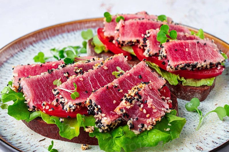 Sandwiches with fried tuna fillet in sesame seeds, breakfast, top view, homemade